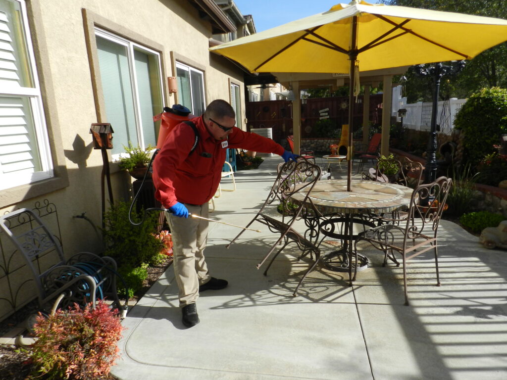 Bull’s Eye Pest Control technician treating a Southern California home for pests