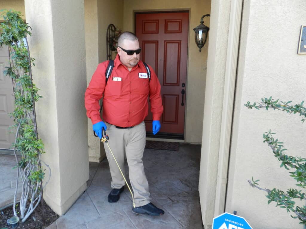 Bull's Eye Pest Control technician treating a Southern California property