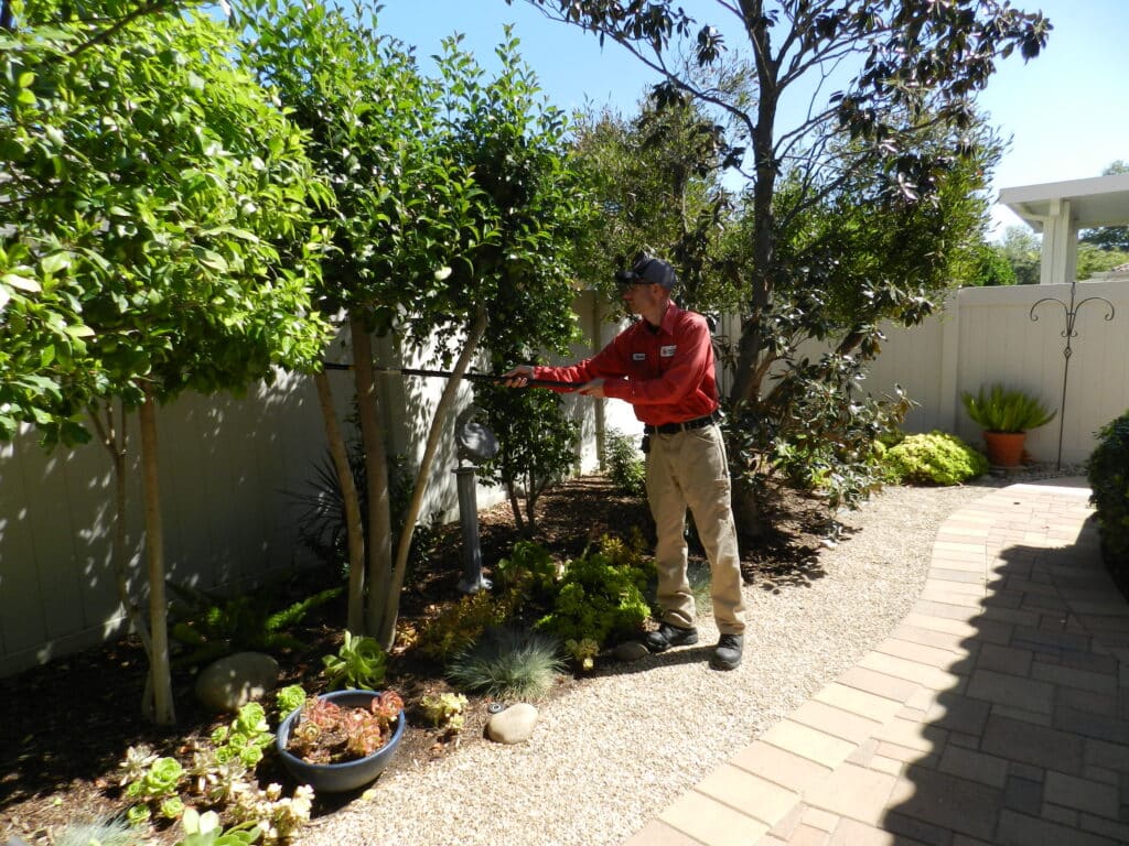 Bull's Eye Pest Control technician treating a Southern California property